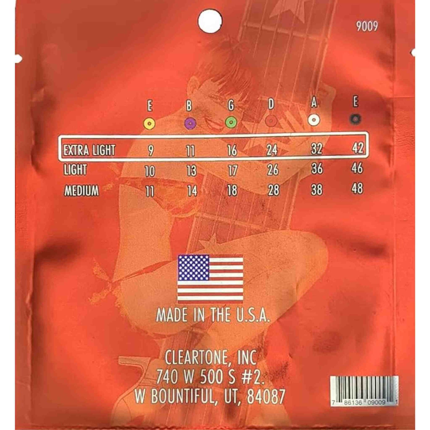 The image shows the back of a Cleartone guitar string package featuring standard tuning notes (E B G D A E) with color-coded circles. It lists three gauge sets: Extra Light (9-11-16-24-32-42), Light (10-13-17-26-36-46), and Medium (11-14-18-28-38-48). The package is orange/red with a guitar silhouette and includes model number 9009, Made in USA label with flag, manufacturer info, and a barcode.