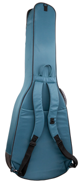 The image shows a teal padded soft-shell guitar gig bag with backpack straps and a top handle. It features a full-length zipper, an external front pocket for accessories, and reinforced edges for durability. Designed for full-size acoustic or electric guitars, it offers lightweight, portable protection ideal for everyday transport.