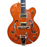 Close up of the body of the Limited Edition Gretsch Orange electric Hollow body guitar signature Reverend Horton Heat design with a white background