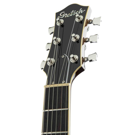 The front of a Gretsch guitar headstock on a white background
