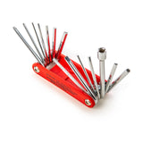 Red Drum multi-tool with various metallic components on a white background