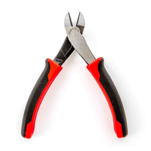 The image shows a pair of wire cutters with black and red ergonomic handles, sharp cutting edges, and "CRAFTECH" branding on the metal head. Designed as a musical instrument accessory, these precision cutters are ideal for trimming guitar, bass, and other stringed instrument wires during restringing. They provide clean cuts to prevent fraying, ensuring proper string installation and tuning stability.
