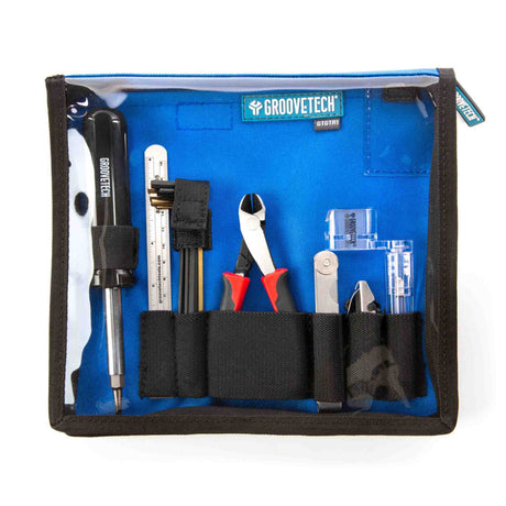 GrooveTech guitar tool kit with various tools inside a blue case on a white background