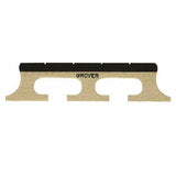 The image shows a Grover violin bridge made of light-colored wood, likely maple. It features the typical arched shape with two curved cutouts for strings, with "GROVER" printed on the top edge. The bridge has a thin, precise profile and two feet at the bottom that rest on the violin’s top plate. This essential component transfers string vibrations to the instrument’s body and requires careful fitting by a luthier.