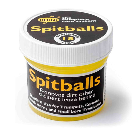 The image shows a small plastic jar of Herco Spitballs, a brass instrument cleaning accessory from the complete care system. Sized standard 18, these spitballs are designed to remove dirt left behind by other cleaners. Compatible with trumpets, cornets, French horns, and small bore trombones, they clean the interior tubing by pushing out buildup with water or air pressure.