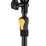 Close-up of a black and yellow adjuster for a light and camera stand on a white background 