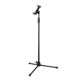 A black tripod stand with a tablet holder