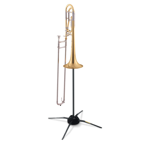 Trombone resting on a black trombone stand on a white background