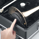 Hand pointing to a folded up trombone stand being store in the bell of a trombone in a black case