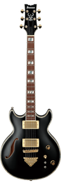 The image shows an Ibanez semi-hollow electric guitar with a black finish and gold hardware. It features two gold-covered humbucker pickups, a black headstock with the Ibanez logo and ornate inlay, a rosewood fretboard with decorative inlays, six gold tuning pegs (3+3), multiple control knobs, a pickup selector switch, and a gold bridge. This high-end model is likely from the Artist series, known for its warm, resonant tone.