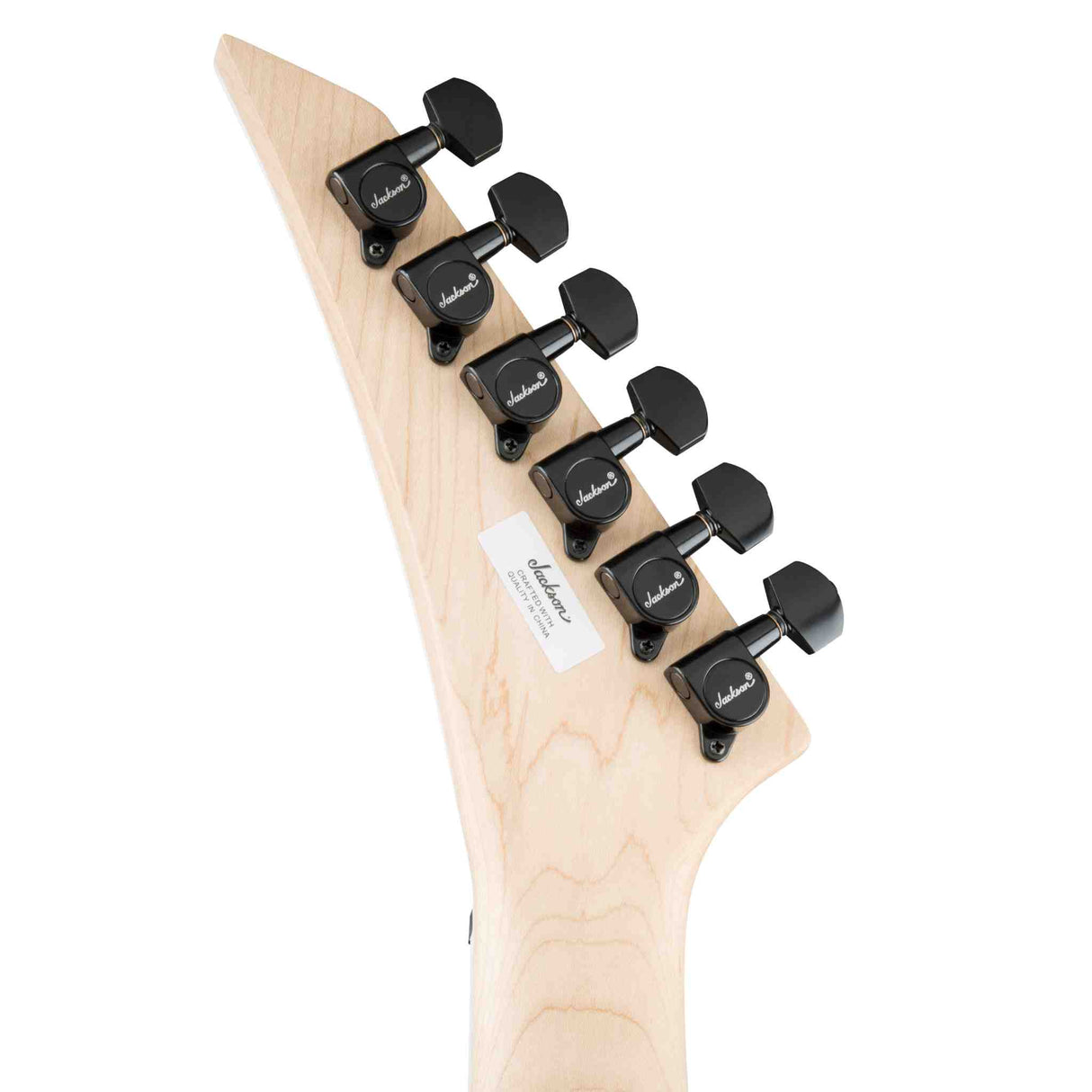 The back headstock of a Jackson  Ferrari red Jackson JS Series King V JS32T, electric guitar. Headstock is maple with black machine heads with the Jackson logo on them. 