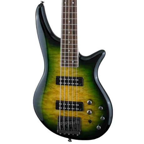 Close-up picture of a the front body of a Jackson JS Series Spectra Bass JS3QV featuring a finish called Alien Burst which does from a light yellow green in the center to progressively darker green on the edges. The body has black pick ups, black pickup selector switch and a black bridge with silver selector knobs for volume and tone.