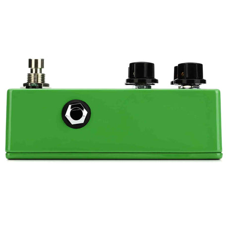 Green guitar effects pedal with three knobs on a white background