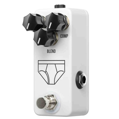White guitar effects pedal with black knobs and 'Blend' and 'Comp' labels on a white background