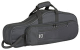The image shows a charcoal gray soft-sided gig bag for a tenor saxophone or similar wind instrument. It has multiple zippered pockets, padded handles, an adjustable shoulder strap, and a white logo featuring a "K" or similar letter. The durable, reinforced case has an elongated curved shape matching the instrument, designed for lightweight, portable protection and accessory storage.