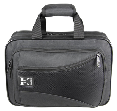 The image shows a durable gray soft-sided gig bag or musical instrument case with a padded handle, multiple zippered compartments, and reinforced edges. It features a "KACES" logo and a professional, utilitarian design. Sized for small keyboards, audio gear, wind instruments, or accessories, it offers lightweight, portable protection for musicians' equipment.