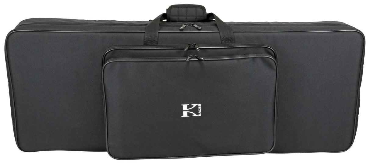The image shows a black soft-sided keyboard gig bag with padded protection, multiple carrying handles, and several zippered compartments for an electronic keyboard or digital piano. It features a white "K" logo, likely from the Kaces brand, and includes storage pockets for accessories, making it lightweight and portable for musicians transporting their instruments and gear.