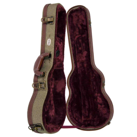 The image shows a vintage-style guitar hard case with an olive/tan tweed or canvas exterior, brown leather trim and corners, and brass-colored latches. It has a brown leather handle and a molded, guitar-shaped interior lined with plush burgundy velvet to protect the instrument. This hard case offers durable protection, favored by musicians for touring, recording, or storing guitars safely.