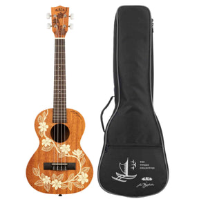 The image shows a Kala ukulele with a natural wood body featuring a white hibiscus floral design, four strings, chrome tuning pegs, a dark fretboard, and the "KALA" logo on the headstock. Next to it is a black soft case from the "Voyage Collection" with the Kala logo, sailing ship graphic, and carrying handle, reflecting a Hawaiian and nautical theme.