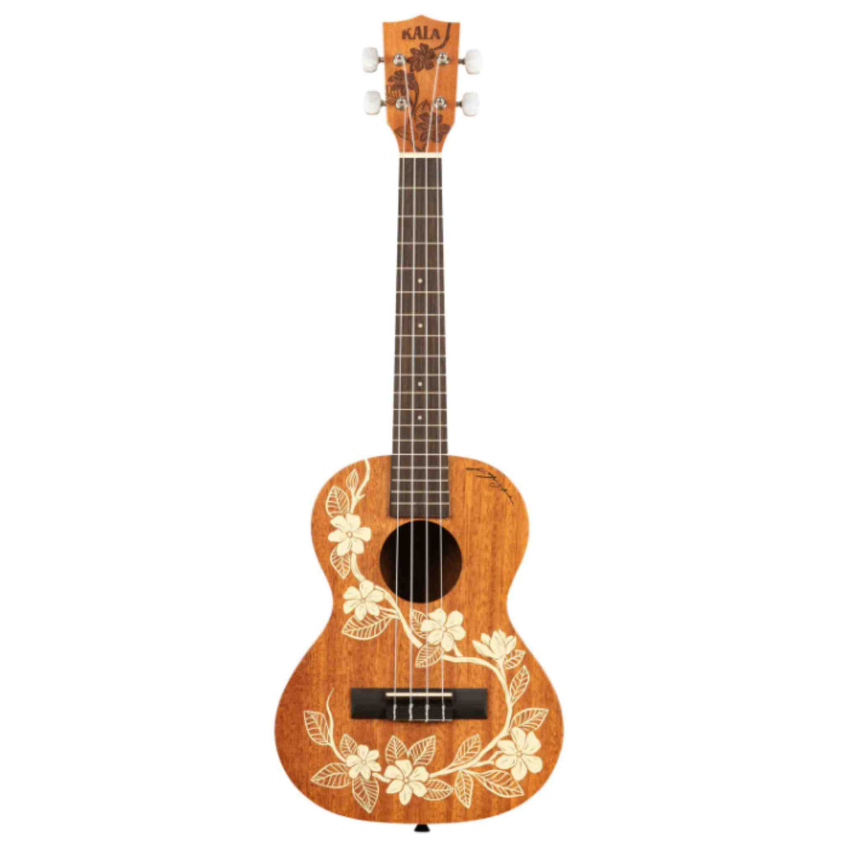 The image shows a Kala ukulele with a natural golden-brown wood finish and white hibiscus flower and leaf designs. It has four strings, a dark wood fretboard with markers, white tuning pegs, a black bridge, and a traditional sound hole. The concert or tenor-sized instrument features a classic Hawaiian style, reflecting its origins and Kala’s reputation for quality ukuleles suitable for all skill levels.