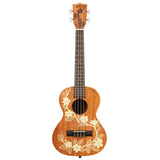 The image shows a Kala ukulele with a natural golden-brown wood finish and white hibiscus flower and leaf designs. It has four strings, a dark wood fretboard with markers, white tuning pegs, a black bridge, and a traditional sound hole. The concert or tenor-sized instrument features a classic Hawaiian style, reflecting its origins and Kala’s reputation for quality ukuleles suitable for all skill levels.