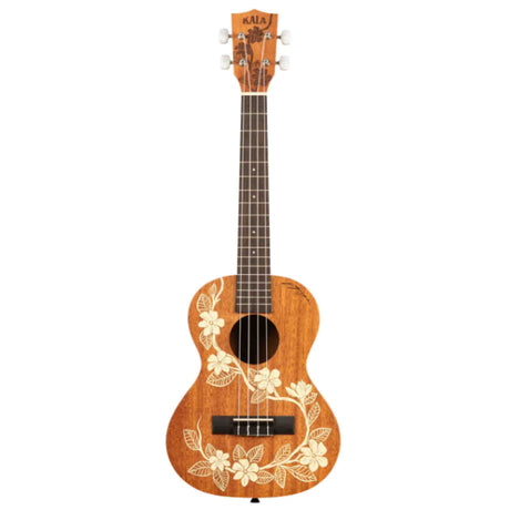 The image shows a Kala ukulele with a natural golden-brown wood finish and white hibiscus flower and leaf designs. It has four strings, a dark wood fretboard with markers, white tuning pegs, a black bridge, and a traditional sound hole. The concert or tenor-sized instrument features a classic Hawaiian style, reflecting its origins and Kala’s reputation for quality ukuleles suitable for all skill levels.