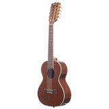 The image shows a wooden ukulele with a warm brown finish and visible grain. It features four strings, traditional tuning pegs, light-colored binding, a dark bridge, and a fretted neck with position markers. Its size suggests a concert or tenor model. The instrument rests against a white background, likely for a product photo, highlighting its quality craftsmanship.