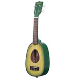 The image shows a novelty soprano ukulele designed to resemble an avocado. The body mimics an avocado half with yellow-green flesh and dark green skin, while the sound hole is placed where the pit would be, painted dark brown. It features four strings, standard fretboard with markers, tuning pegs, and a green Kala-branded headstock. This fun, functional instrument blends creative design with traditional ukulele elements.