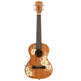 The image shows a Kala ukulele with a classic body shape and four strings. It has a natural mahogany finish, white tuning pegs, a dark fretboard with position markers, and a central sound hole. The body features decorative hibiscus flower and leaf designs for a tropical Hawaiian look. The headstock displays the "KALA" logo. A black rectangular pickup near the sound hole indicates it is an acoustic-electric model.