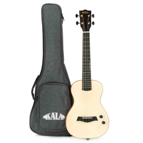 The image shows a KALA brand ukulele with a light wooden body, dark neck and headstock featuring four tuning pegs in a 2x2 layout, and a visible KALA logo. It includes electronics with controls on the body. The ukulele rests next to a dark gray padded gig bag with the KALA logo, zipper, shoulder straps, and an exterior pocket. This electric or acoustic-electric ukulele is designed for both unplugged and amplified play.
