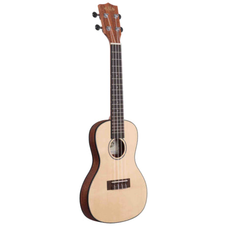 The image shows a ukulele with a small, compact body and natural light wood finish, likely spruce or cedar, with darker binding. It has a round sound hole, four strings, four tuning pegs, a fretted neck with markers, and "Kala" branding on the headstock. The instrument appears to be a concert or tenor size, suitable for beginners and experienced players, known for its bright, cheerful sound.