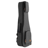 The image shows a soft-shell guitar gig bag with a dark gray textured fabric exterior, black trim, brown leather-like accents, and hardware. It has multiple carrying straps, a front pocket for accessories, and padded construction to protect the instrument. This lightweight, portable case offers protection against minor impacts, dust, and weather, making it ideal for transporting guitars to gigs, lessons, or recordings.