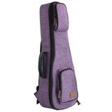 The image shows a modern violin soft case or gig bag with a purple/lavender textured fabric exterior, black trim, and zippers. It has backpack-style shoulder straps, a front zippered pocket with a small tan label, and a shape tapering from the body to the neck. Designed for lightweight, portable violin storage and transport, it offers protection and convenience for musicians on the go.