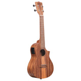 The image shows a beautiful acoustic-electric ukulele with a warm-toned wooden body, likely koa or mahogany. It has four strings and tuning pegs, a cutaway design for easier fret access, and a black pickup/preamp on the side. The fretboard has multiple frets with position markers, and the traditional wooden bridge features a bone or synthetic saddle. It appears to be a concert or tenor size, suitable for both casual and performance use.