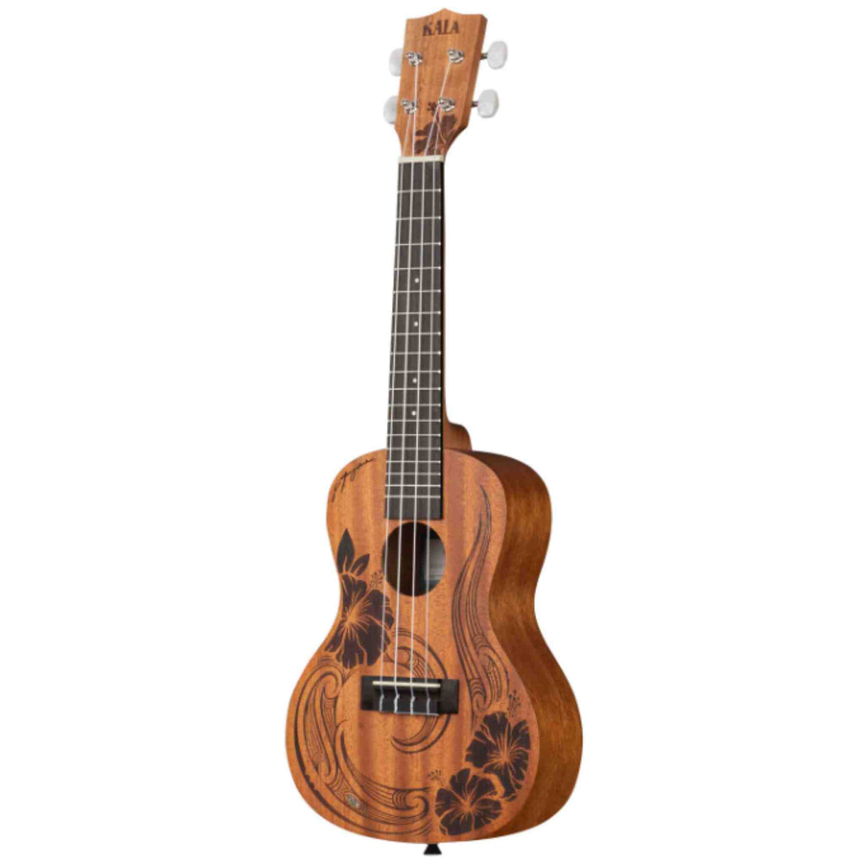 The image shows a Kala tenor or concert ukulele with a natural mahogany finish. It features a laser-etched hibiscus and swirl design on the soundboard, white tuning pegs, a dark fretboard with position markers, and four nylon strings. The traditional figure-8 body shape and sound hole reflect classic design, combining visual appeal and quality construction typical of Kala instruments.