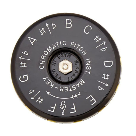The black underside of the Kratt Chromatic pitch pipe with musical notation on a white background