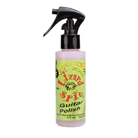 The image shows a 4 fl. oz. bottle of Lizard Spit Guitar Polish, a guitar care product in a clear spray bottle with a black nozzle. The green label features colorful graphics and branding, claiming to be "America's Spit Shine" and the "World's Most Effective Guitar Polish." It is used by musicians and technicians to clean, polish, and protect guitar finishes.