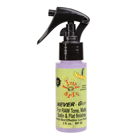 The image shows a 2 fl. oz. bottle of "NEVER-Gloss" guitar care spray with a black trigger nozzle containing light purple liquid. The colorful, vintage-style label features green and yellow tones with a skull or face graphic and states it’s for RAW Tone, Matte, Satin & Flat finishes. This product is designed to clean and protect non-gloss guitar finishes, providing easy spray application for maintenance and preservation.