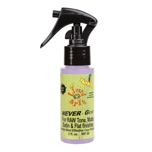 The image shows a 2 fl. oz. bottle of "NEVER-Gloss" guitar care spray with a black trigger nozzle containing light purple liquid. The colorful, vintage-style label features green and yellow tones with a skull or face graphic and states it’s for RAW Tone, Matte, Satin & Flat finishes. This product is designed to clean and protect non-gloss guitar finishes, providing easy spray application for maintenance and preservation.