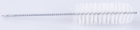 The image shows a long, thin cleaning brush for musical instruments, featuring a twisted wire shaft with white bristles at the tip arranged in a spiral pattern. It is designed to clean the interior of wind instruments like flutes, piccolos, clarinets, and oboes. The flexible wire allows it to reach curved sections, effectively removing moisture and debris to maintain instrument performance.