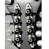 The image shows two parallel rows of tuning pegs on a light-colored wooden guitar headstock. Each peg has a white or cream-colored button attached to black tuning machines mounted on chrome plates. These sealed gear tuning machines, common on acoustic and electric guitars, are essential for adjusting string tension and tuning. The hardware appears clean, professional, and in good condition.