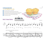 The image shows page 17 of a beginner piano method book featuring the song "Hot Cross Buns." It includes musical notation with treble and bass clefs, finger numbering on a keyboard diagram, rhythm counts, and lyrics. The page offers a "Challenge Repertoire," hand position guide, teacher accompaniment for duet play, and a colorful illustration of hot cross buns, all designed for young learners.