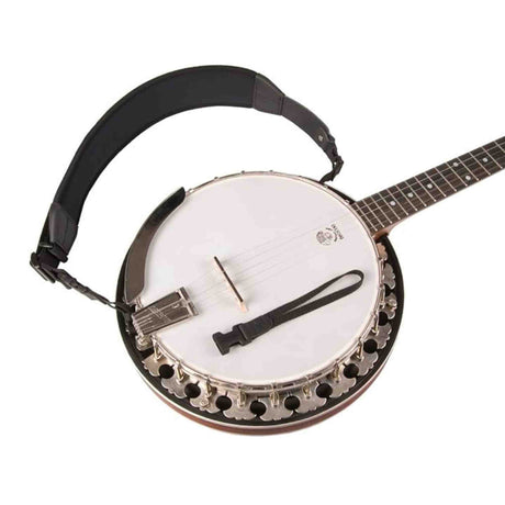 The image shows a complete banjo, a string instrument linked to American folk and bluegrass music. It features a circular body with a white drumhead, a long neck with frets and tuning pegs, multiple strings, tension hooks around the rim, a tailpiece, and a carrying strap. The banjo’s strings are plucked while its drum-like membrane produces a bright, percussive tone.
