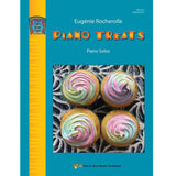 The image shows a piano sheet music book titled "Piano Treats" by Eugénie Rocherolle, published by Neil A. Kjos Music Company as part of the "Center Stage Solos" series. The colorful cover features four pastel cupcakes on a zebra-print surface with a turquoise background and orange title lettering. It is labeled for Early Intermediate/Intermediate players with catalog number WP1212.