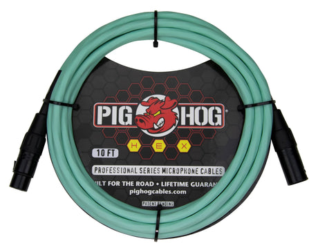 The image shows a 10-foot Pig Hog professional microphone cable from the HEX series, featuring seafoam green/turquoise shielding and black male and female XLR connectors. It displays the Pig Hog red pig logo and is marketed as "built for the road" with a lifetime guarantee. This standard XLR cable connects microphones to audio equipment and is easily identifiable by its distinctive color.