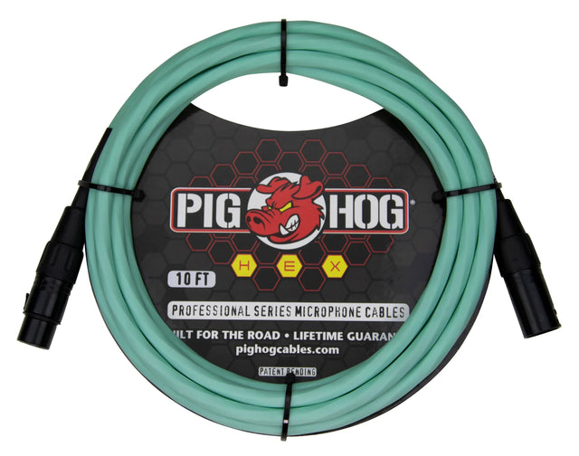 The image shows a 10-foot Pig Hog professional microphone cable from the HEX series, featuring seafoam green/turquoise shielding and black male and female XLR connectors. It displays the Pig Hog red pig logo and is marketed as "built for the road" with a lifetime guarantee. This standard XLR cable connects microphones to audio equipment and is easily identifiable by its distinctive color.