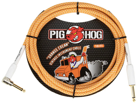 The image shows a Pig Hog "Orange Cream" 10-foot vintage instrument cable with orange and cream braided outer shielding. It features straight 1/4" connectors with gold-plated contacts and high-quality construction. Known for durability and retro design, this cable connects guitars or basses to amps or pedals, combining distinctive style with extra protection for internal wiring.