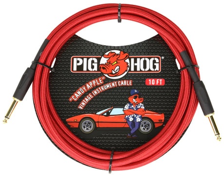 The image shows a 10-foot Pig Hog "Candy Apple" vintage instrument cable in bright red with gold-plated 1/4" connectors. It features a woven red outer jacket and the Pig Hog pig mascot on the packaging, which depicts the pig driving a red sports car. This colorful, durable cable is designed for electric guitars, basses, and amps, combining premium vintage style with reliable performance.