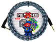The image shows a Pig Hog instrument cable with a colorful woven fabric sleeve in black, white, pink, and teal. It has gold-plated 1/4" connectors on both ends and a 10 FT length marking on the packaging. The Pig Hog logo features their cartoon pig mascot. This durable, tangle-resistant cable is popular with musicians for connecting electric instruments to amps and pedals, noted for its street art-inspired design.