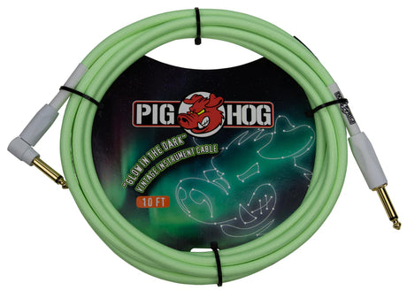 The image shows a Pig Hog 10-foot "Glow in the Dark" instrument cable with a seafoam green jacket that glows in low light. It features gold-plated 1/4" phone plugs with gray housings on both ends. Designed for guitars, basses, and keyboards, the cable is durable and reliable. It is coiled in packaging displaying the Pig Hog logo and their red pig mascot, highlighting the glow-in-the-dark feature.